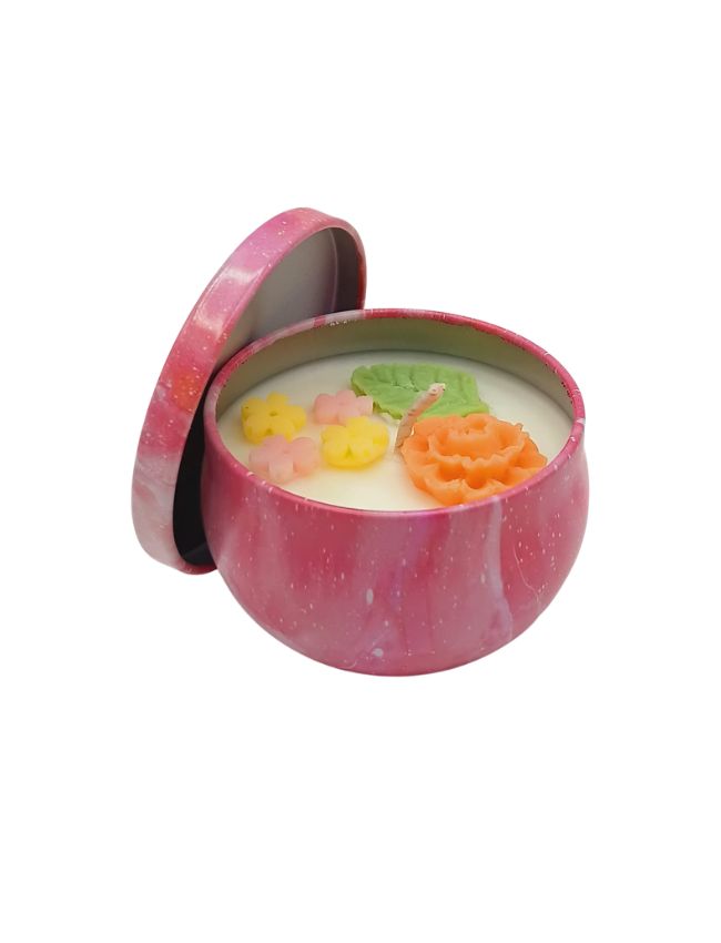 Soy candle in pink decorative tin with floral wax decoration