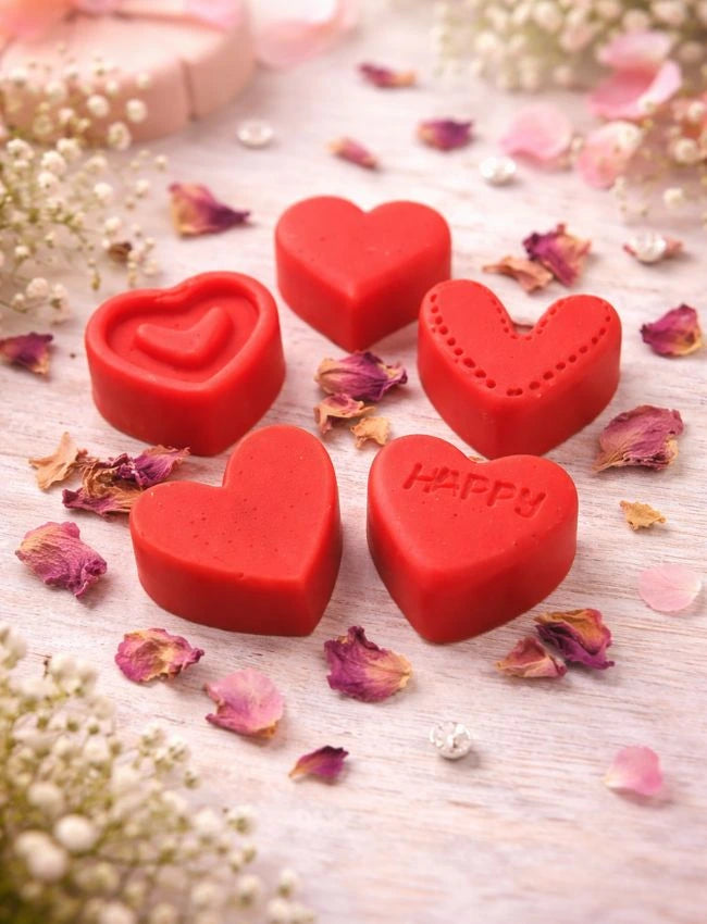 Red heart-shaped Love Spell wax melts