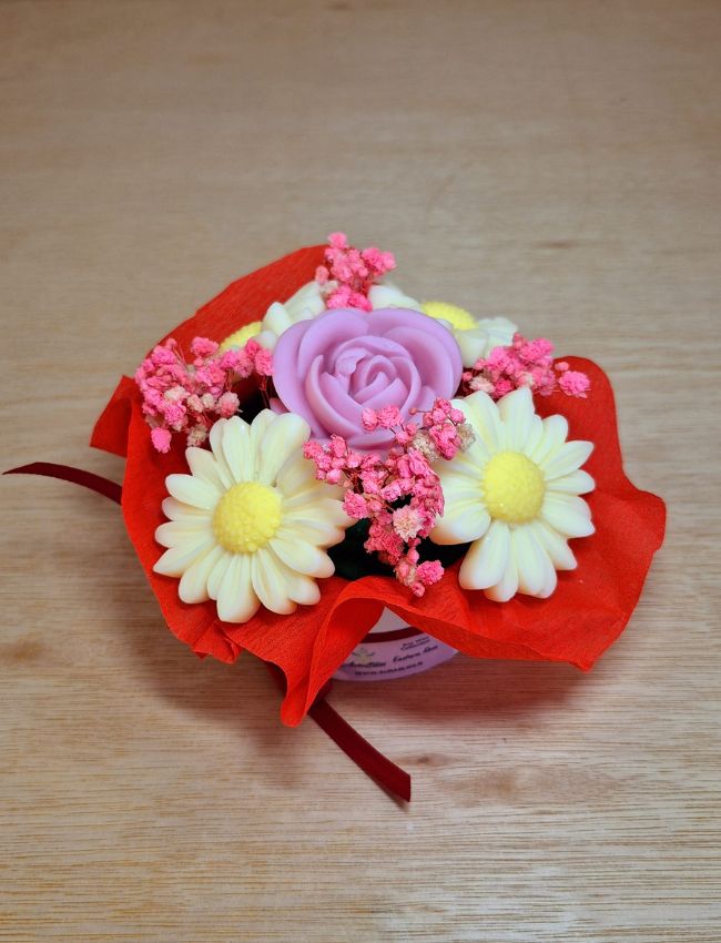 Mixed pastel soy wax candle bouquet arranged in a round base.