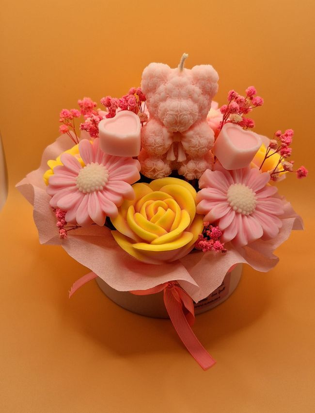 Pink and yellow soy wax floral candle set.