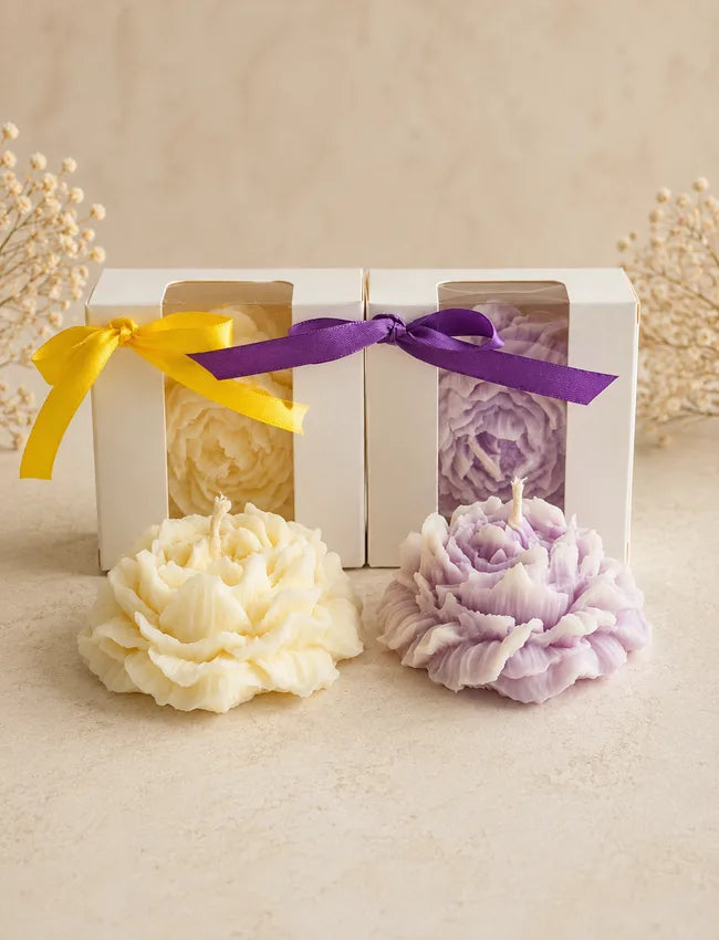 AuraBliss boxed flower-shaped soy wax candles in ivory and lavender gift packaging
