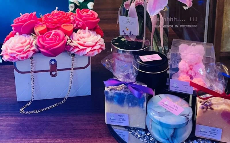 AuraBliss candles and wax flower gifts displayed at Unique Day Spa in Ireland