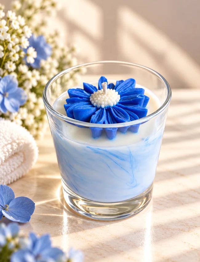 Close-up of Spa Serenity blue floral wax candle topper