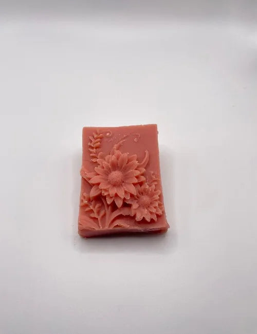A pink Blooming Rose soap bar with detailed floral carvings, perfect for luxurious and natural skincare.