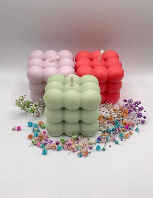 Natural Soy Candle in vibrant colors - purple, green, and red.