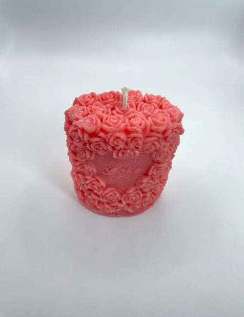 Love candle in vibrant red, crafted with rose patterns, ideal for weddings, romantic occasions, and elegant decor.