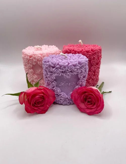 Love candle in soft pink, featuring intricate rose patterns, ideal for weddings, romantic events, or home decoration.