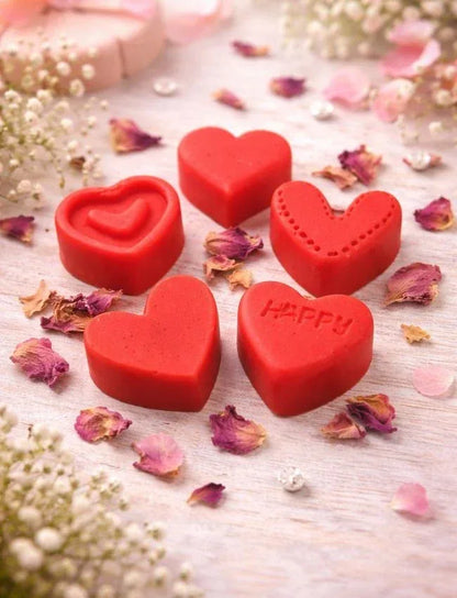 Red heart-shaped wax melts displayed with dried rose petals