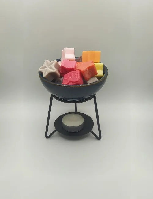 Midnight Blue Ceramic Wax Burner filled with colorful wax melts