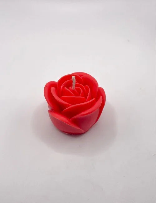 A vibrant red rose-shaped candle, ideal for creating a romantic ambiance or adding elegance to special events.