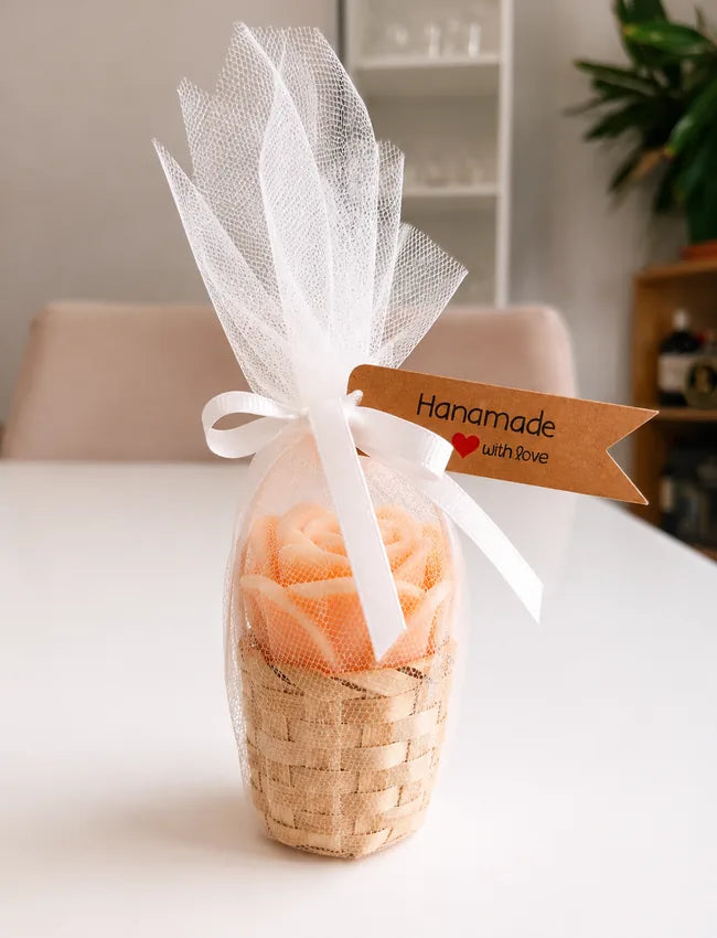 Small woven rose candle gift basket wrapped in white tulle with ribbon and Handmade with Love tag