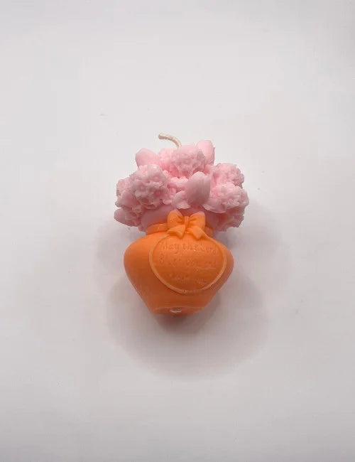 Orange Spring Blossom soy candle with detailed floral designs, adding warmth and charm to any space.