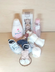 The full contents of the hamper arranged outside the packaging, showcasing all the included baby care products and accessories.