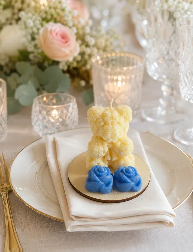 Handmade teddy bear candle wedding table gift styled on an elegant place setting