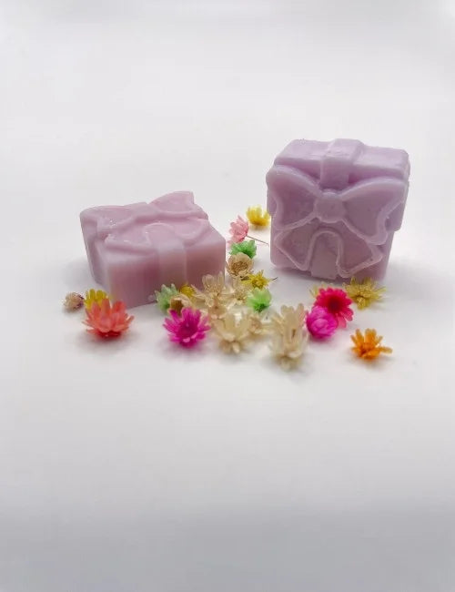 Elegant lavender wax melt gift box styled with delicate flowers.
