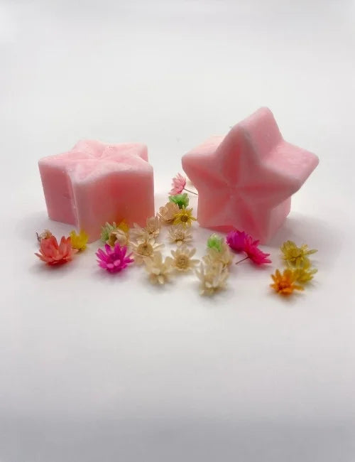 Pink Wax Melts Star with floral accents, offering a sweet aroma.