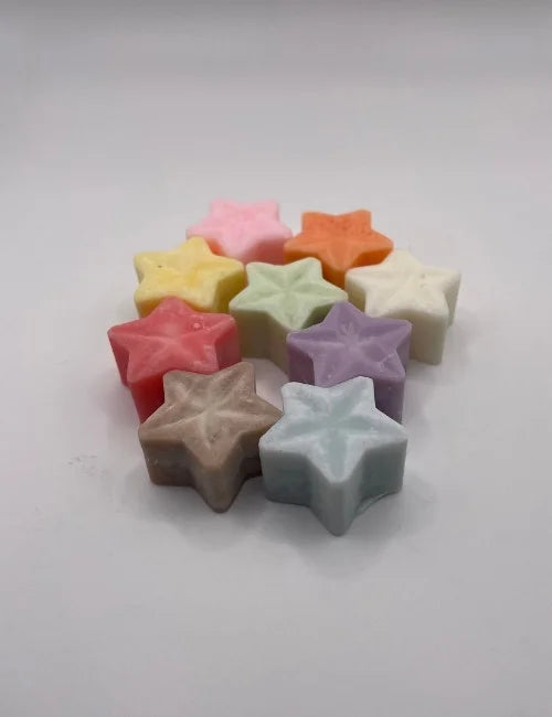 Wax Melts Star in assorted colors, perfect for home fragrances, with floral accents.